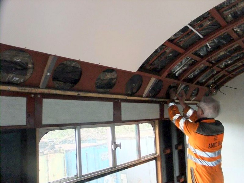 Class 100: Installing wall supports for the panels that fit above the luggage racks